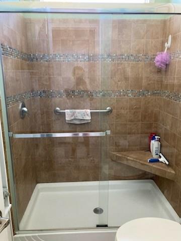 646 Southwest 33rd Cove Okeechobee, FL 34974 - Photo 18 of 19 a bathroom with a shower