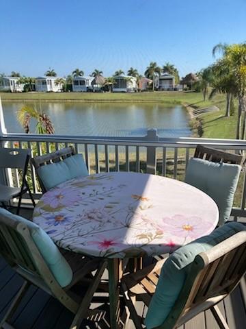 646 Southwest 33rd Cove Okeechobee, FL 34974 - Photo 6 of 19 a view of a chairs and table on wooden deck and lake view