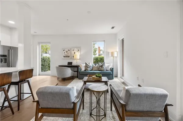 a living room with furniture and a table