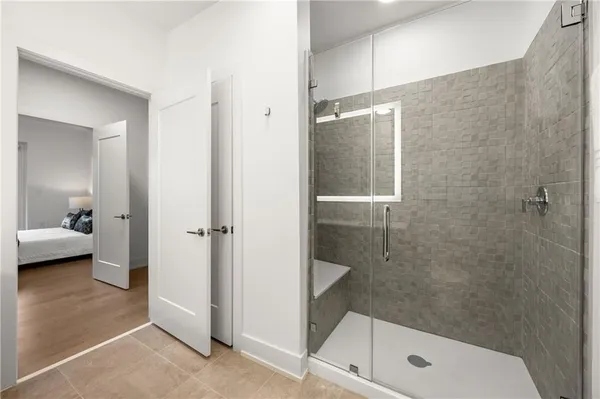 a bathroom with a shower and a sink