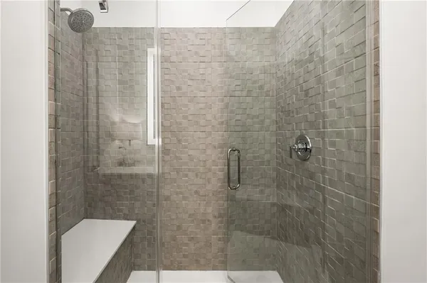 a bathroom with a shower and toilet