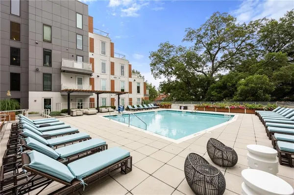 a view of a patio with swimming pool table and chairs