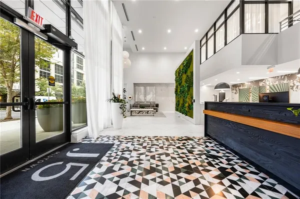a room with gym equipment and a rug