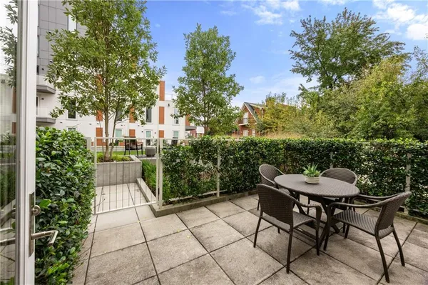 a view of a chairs and table in the patio