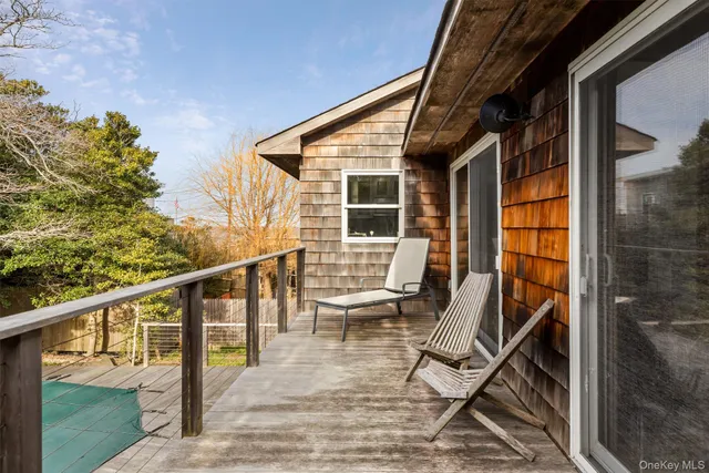 a view of a balcony with chairs