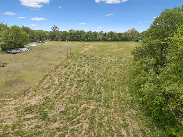 a view of a lake with a yard