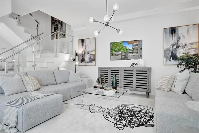 a view of a roof deck with couches and potted plant