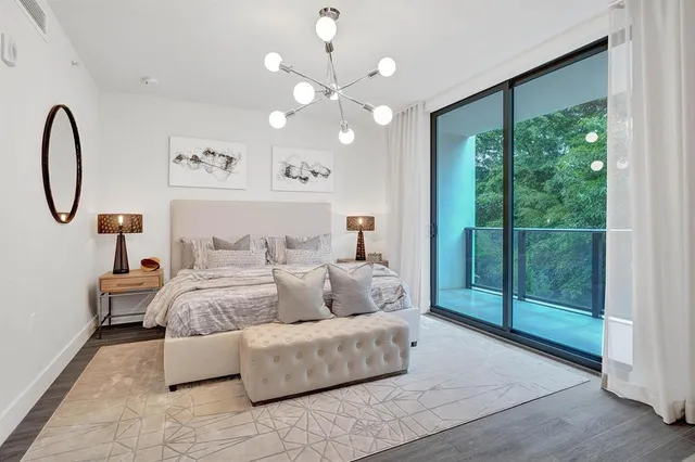 a bathroom with a double vanity sink a mirror and a bathtub
