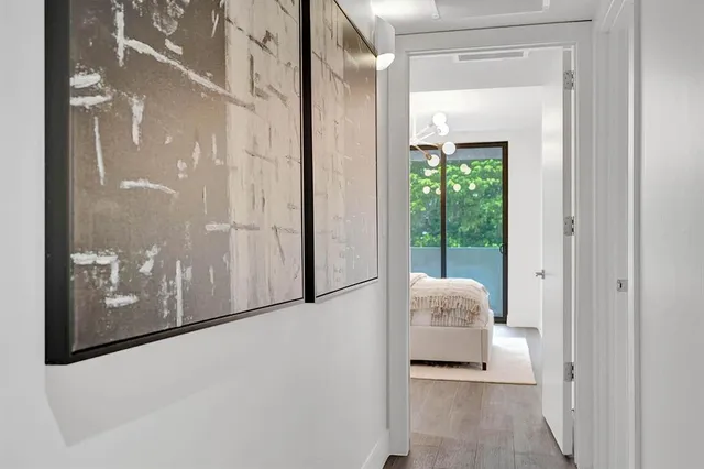 a large white bed in a white room