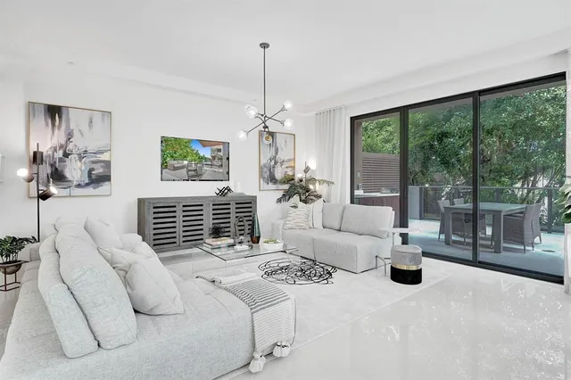 a very nice looking dining room with furniture window and outside view