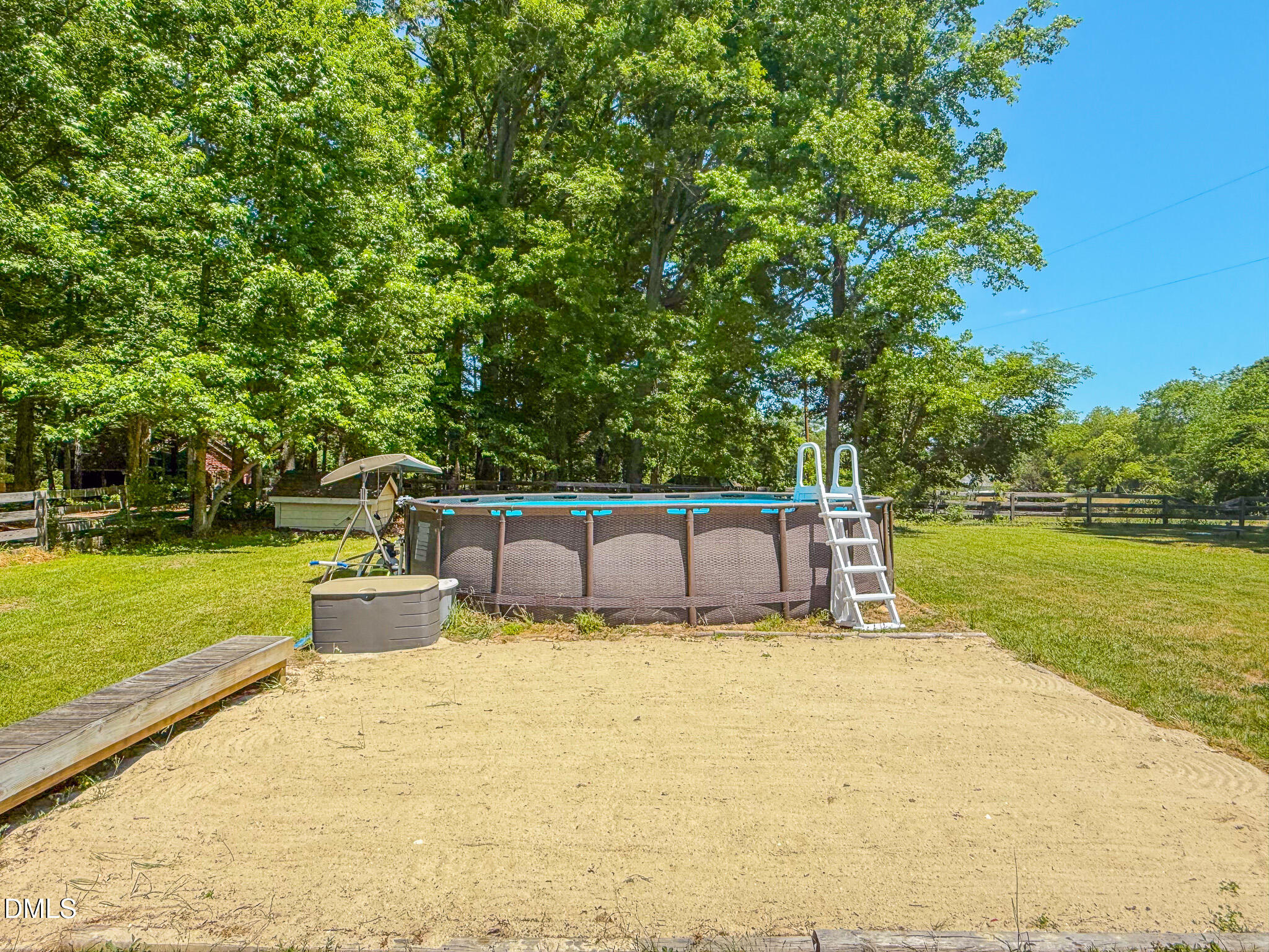220 Bacon Road Rougemont, NC 27572 - Photo 12 of 42 a view of a swimming pool with a garden and seating area