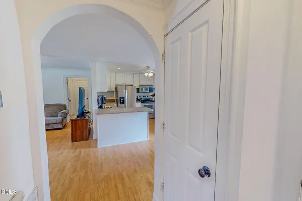 a view of kitchen with furniture and refrigerator