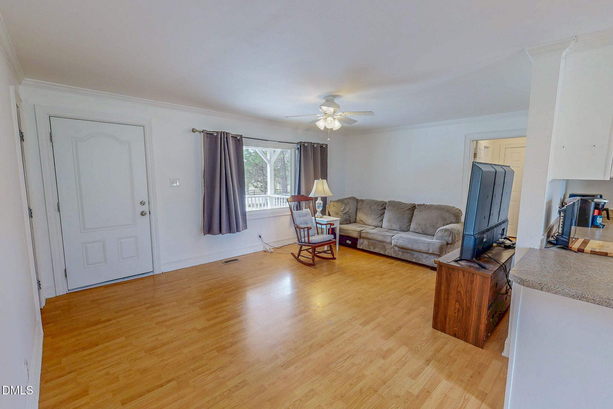 220 Bacon Road Rougemont, NC 27572 - Photo 31 of 42 a living room with furniture and a wooden floor
