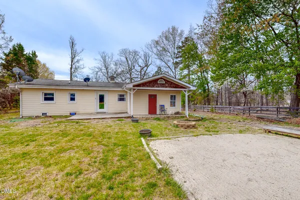 a view of house with outdoor space and swimming pool