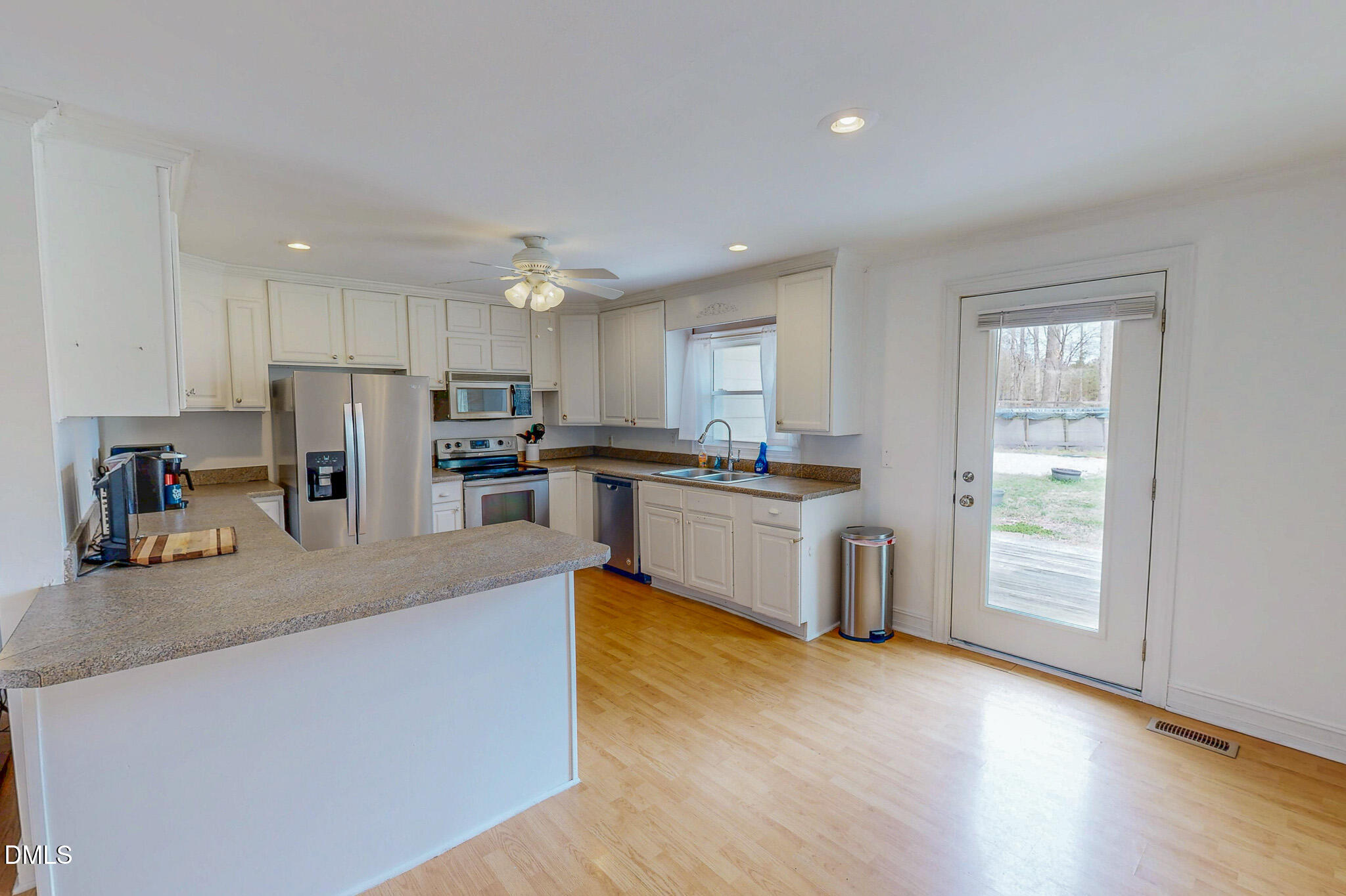 220 Bacon Road Rougemont, NC 27572 - Photo 32 of 42 a kitchen with stainless steel appliances granite countertop a refrigerator sink and cabinets