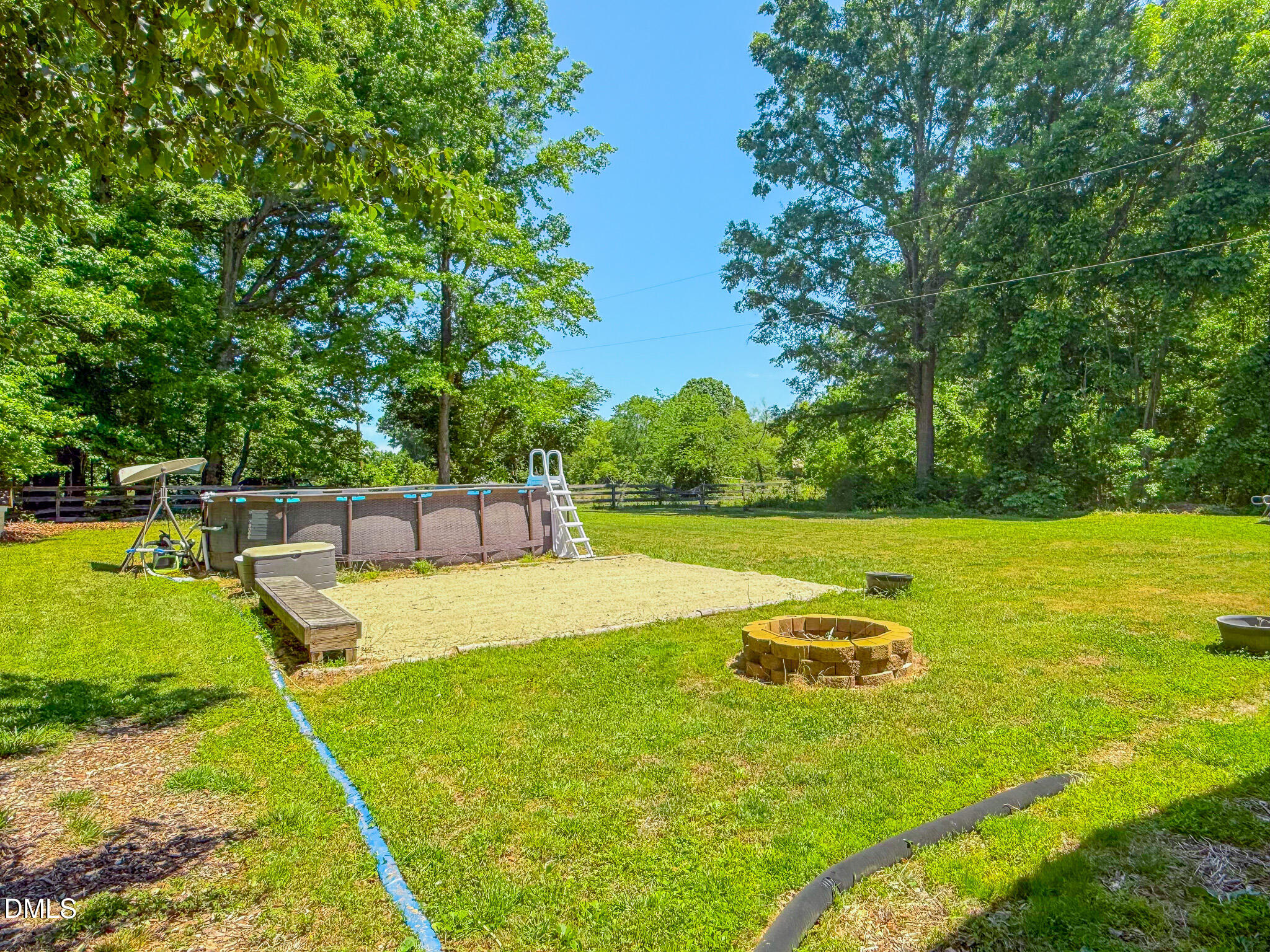 220 Bacon Road Rougemont, NC 27572 - Photo 4 of 42 a view of a swimming pool with a yard