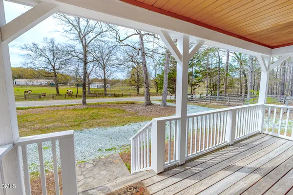 a view of swimming pool with wooden floor and outdoor space