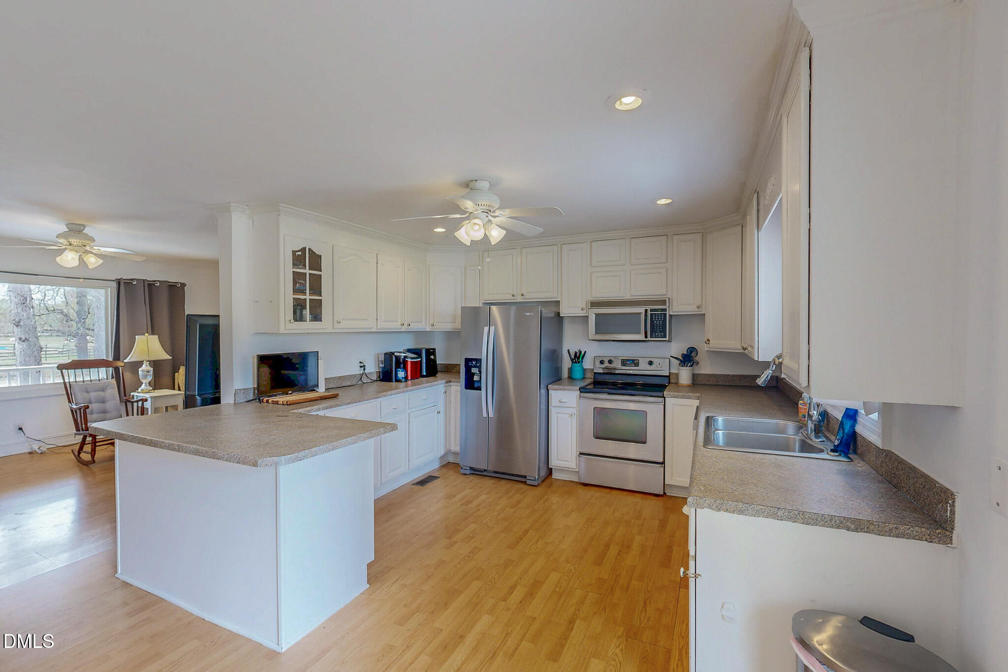 220 Bacon Road Rougemont, NC 27572 - Photo 7 of 42 a large kitchen with a stove a sink and a refrigerator