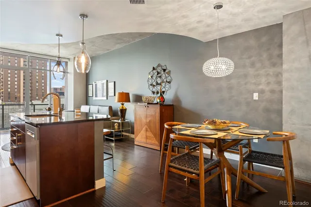 a living room with furniture a flat screen tv and a large window