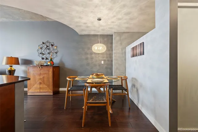 a view of a dining room with furniture and window