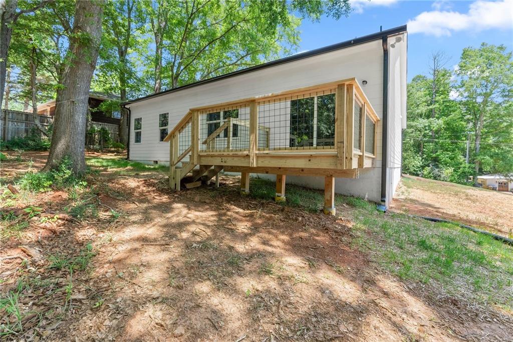 43 Anderson Street Jefferson, GA 30549 - Photo 35 of 45 a view of a house with backyard and sitting area