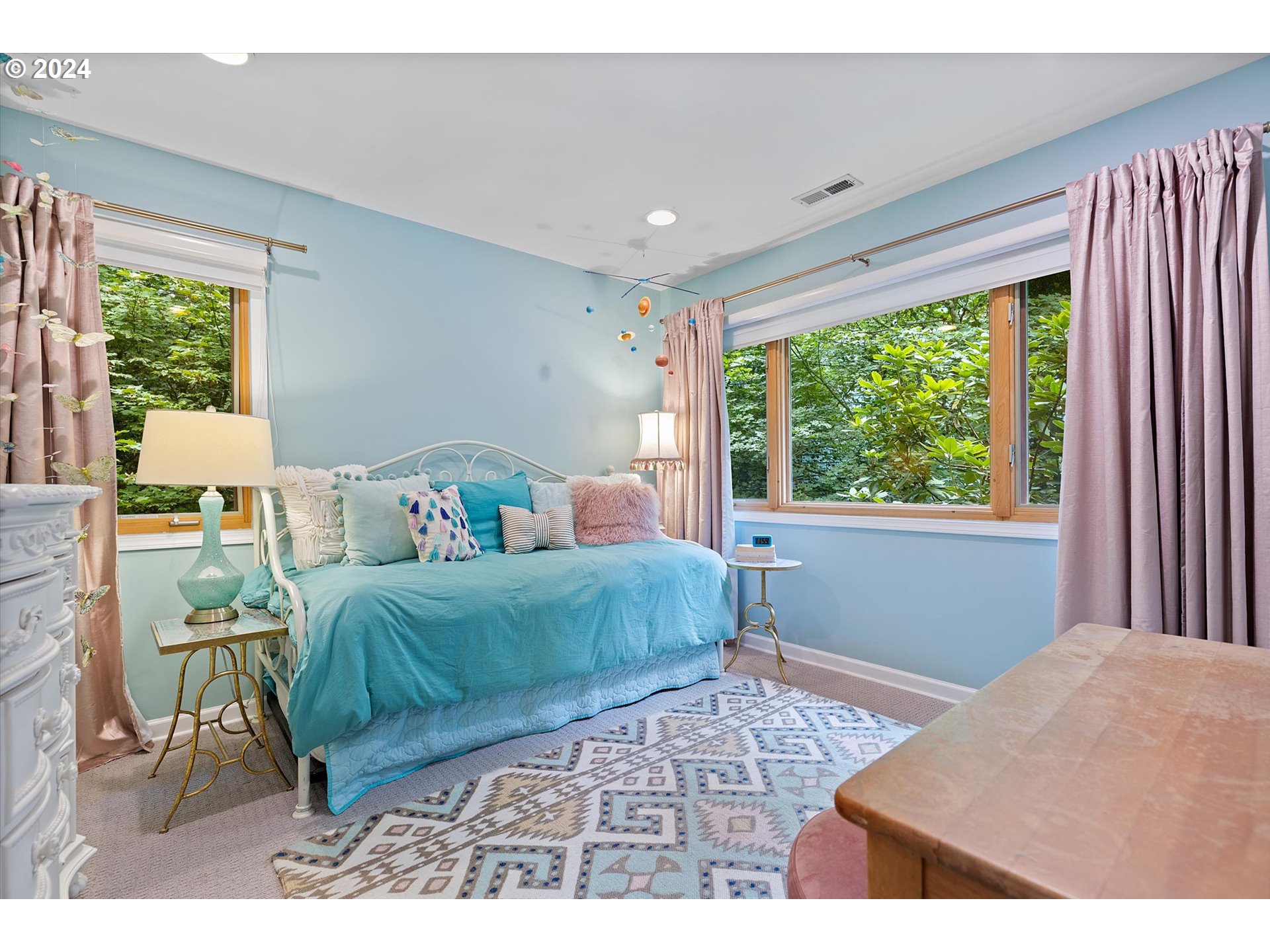 3427 Southwest Dosch Road Portland, OR 97239 - Photo 16 of 48 a bedroom with a bed and a window