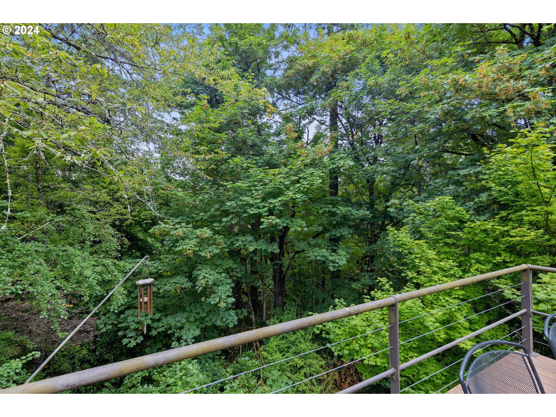3427 Southwest Dosch Road Portland, OR 97239 - Photo 22 of 48 a view of a forest from a balcony