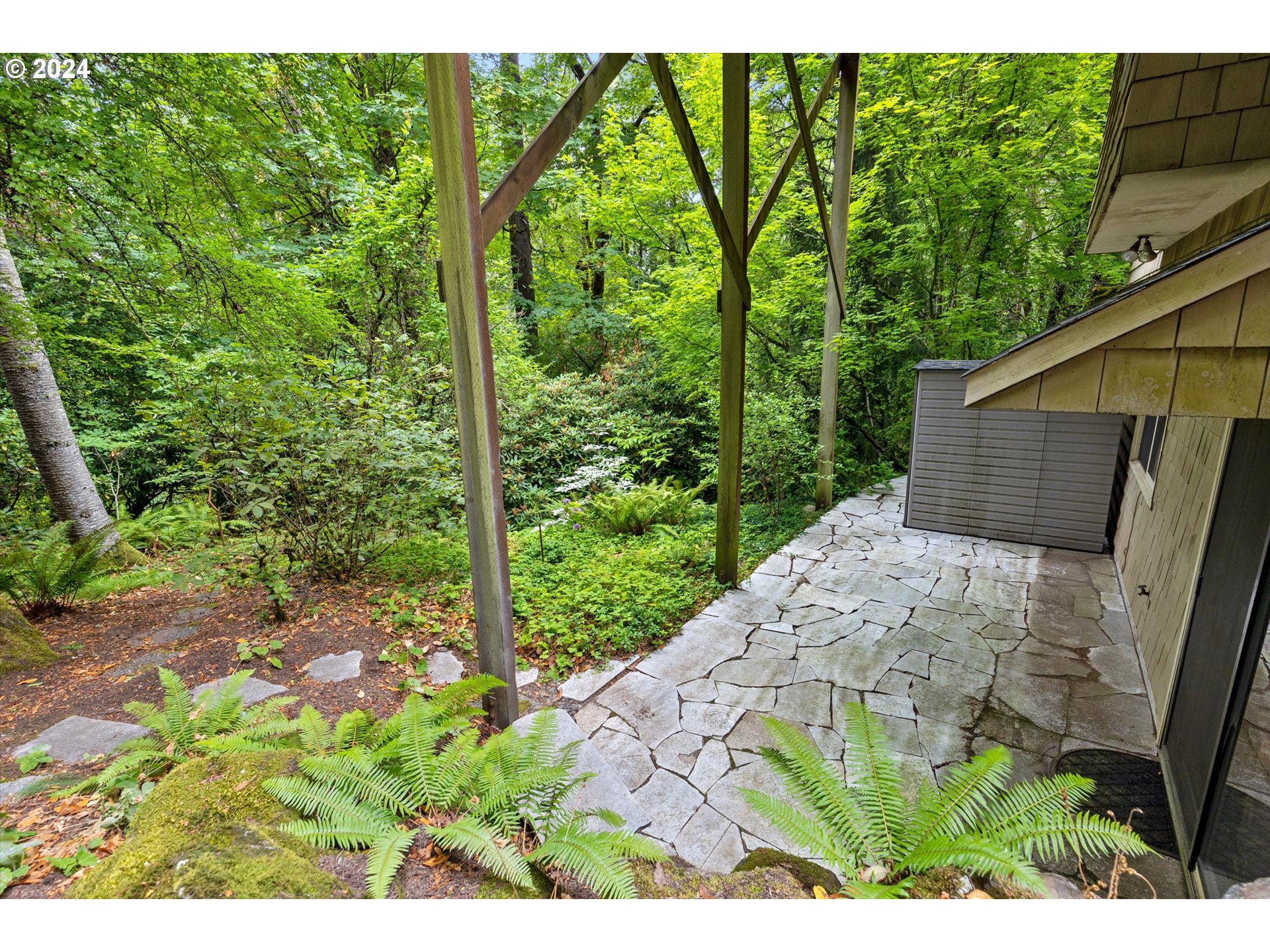 3427 Southwest Dosch Road Portland, OR 97239 - Photo 39 of 48 a view of a backyard with plants