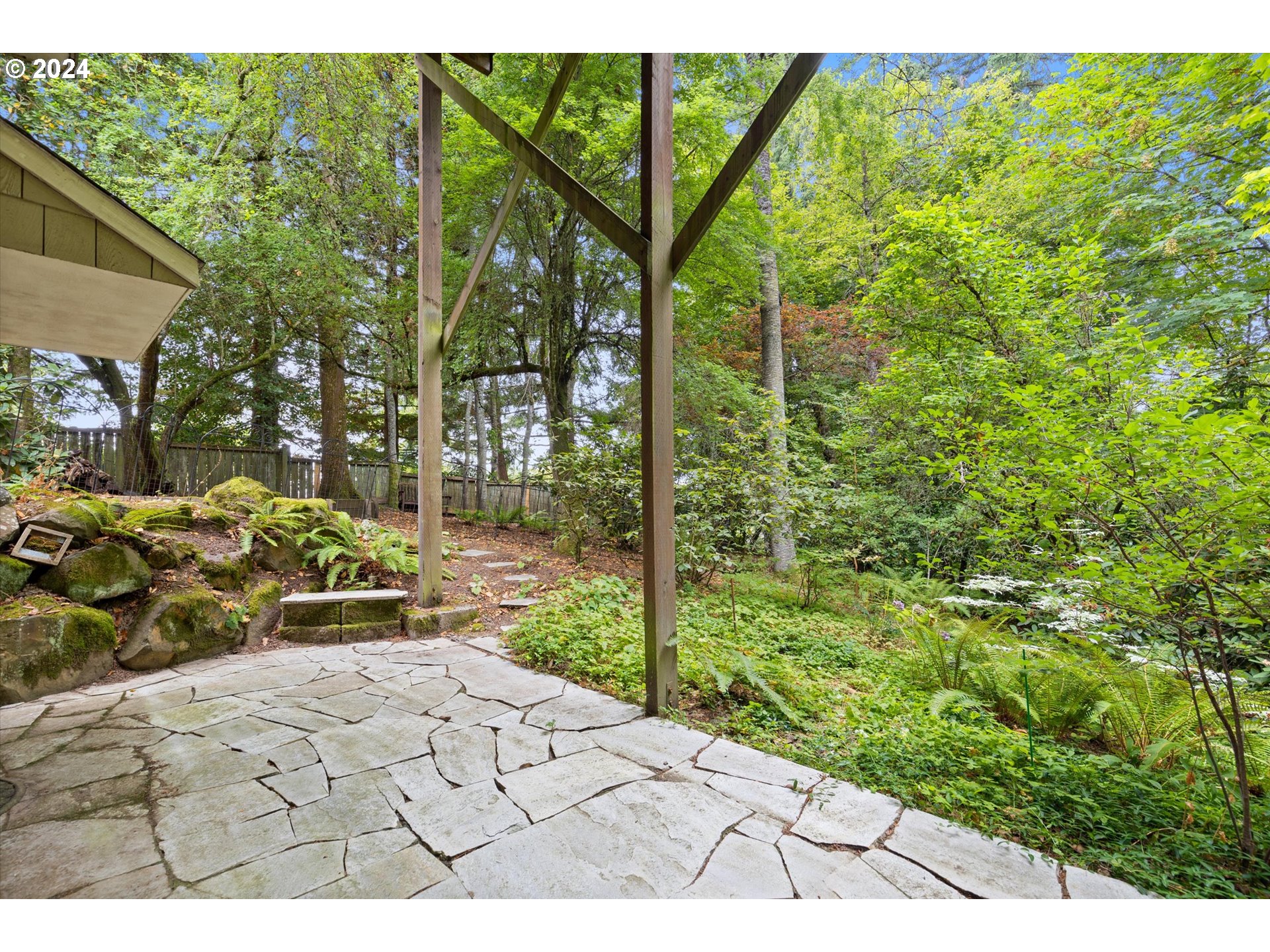 3427 Southwest Dosch Road Portland, OR 97239 - Photo 40 of 48 a view of a bench in the garden