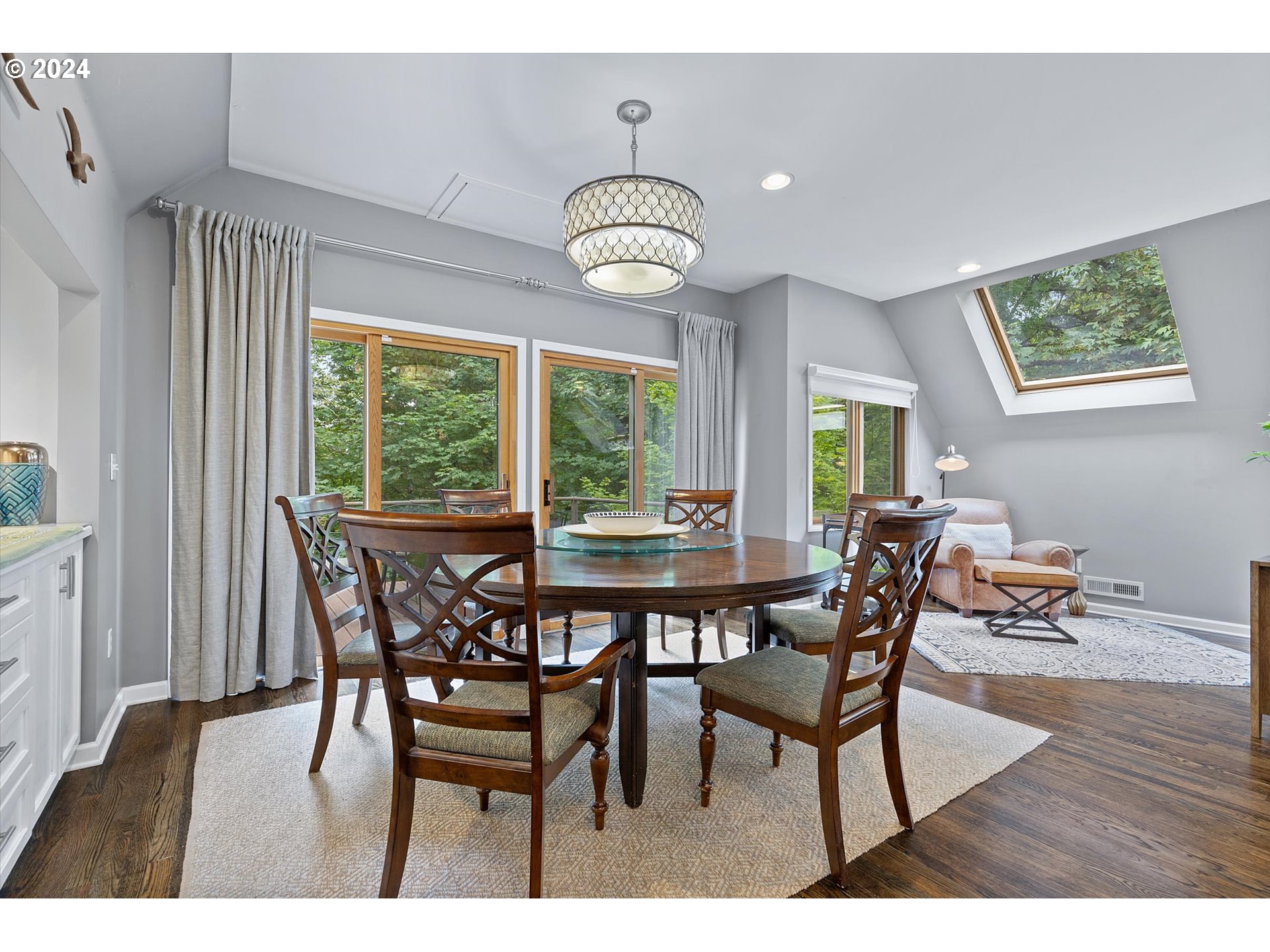 3427 Southwest Dosch Road Portland, OR 97239 - Photo 4 of 48 a view of a dining room with furniture window and wooden floor