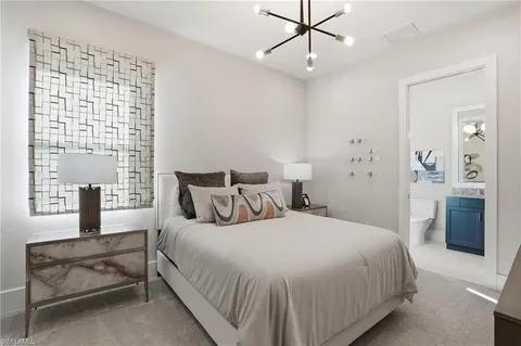 a bedroom with bed and window