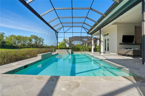 a view of a backyard with plants and a patio
