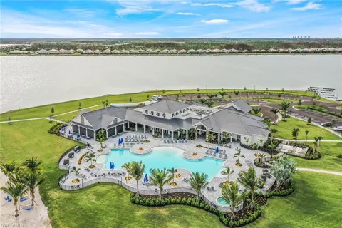 an aerial view of a house with a ocean view