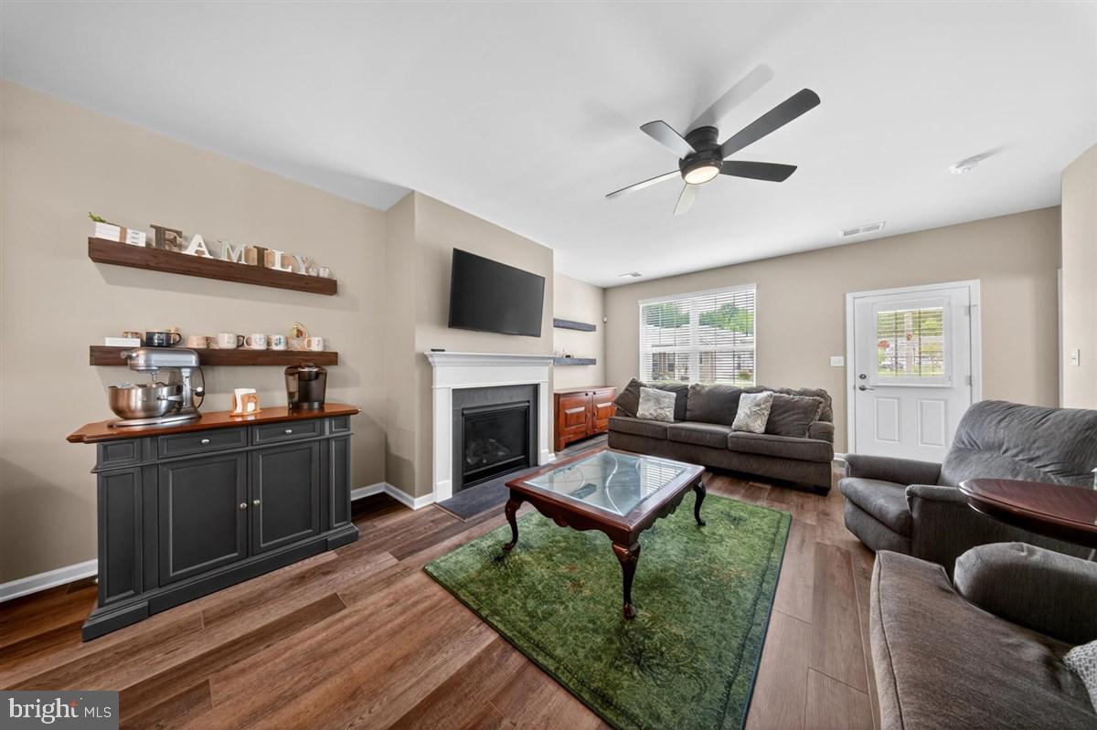 1426 Whispering Woods Road Middletown, DE 19709 - Photo 16 of 37 a living room with furniture fireplace and a window