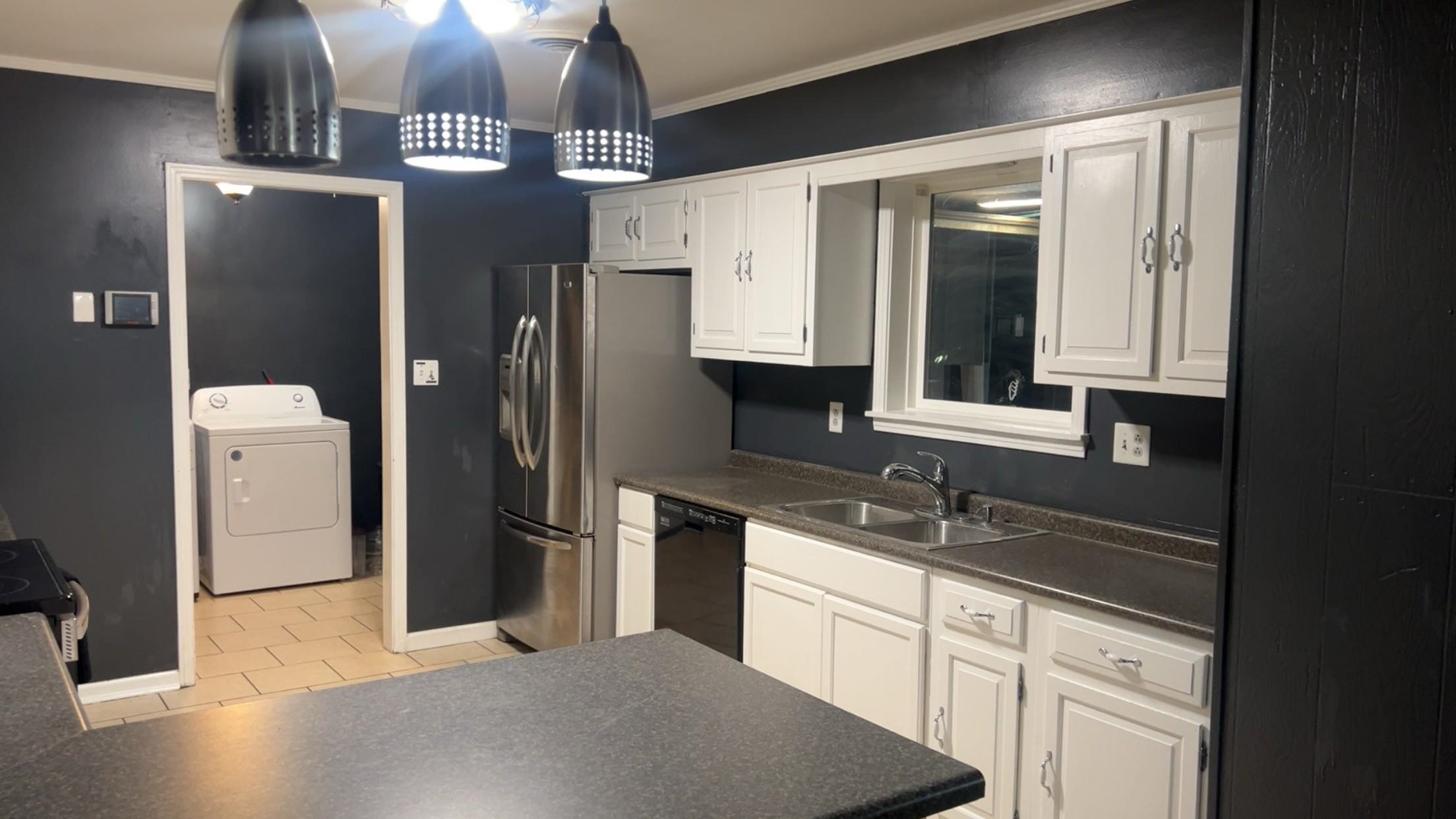 332 Waits Road Burlison, TN 38015 - Photo 11 of 11 a kitchen with stainless steel appliances granite countertop a refrigerator and a sink