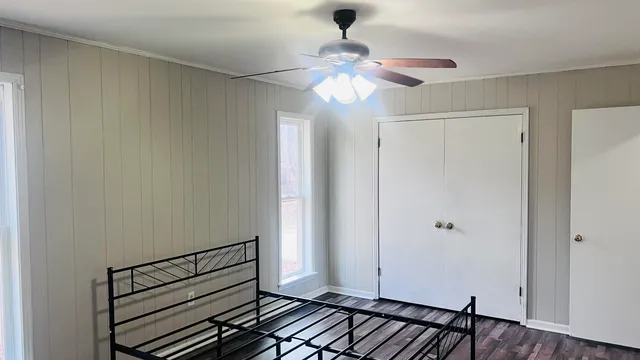 a view of a room with wooden floor