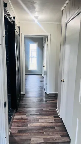 a view of gallery with wooden floor