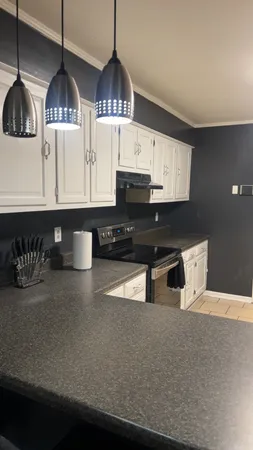 a bathroom with a glass shower door and a sink