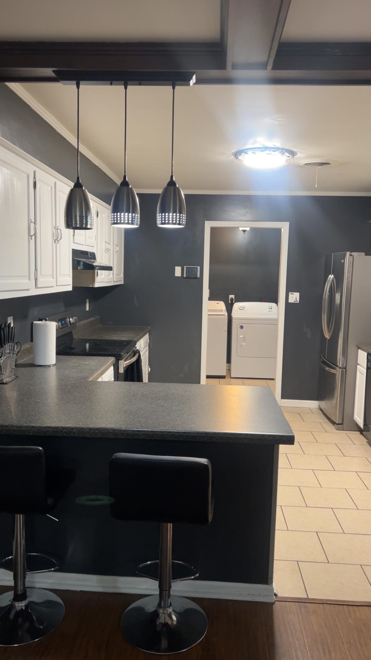 332 Waits Road Burlison, TN 38015 - Photo 9 of 11 a kitchen with stainless steel appliances a sink a counter space and cabinets
