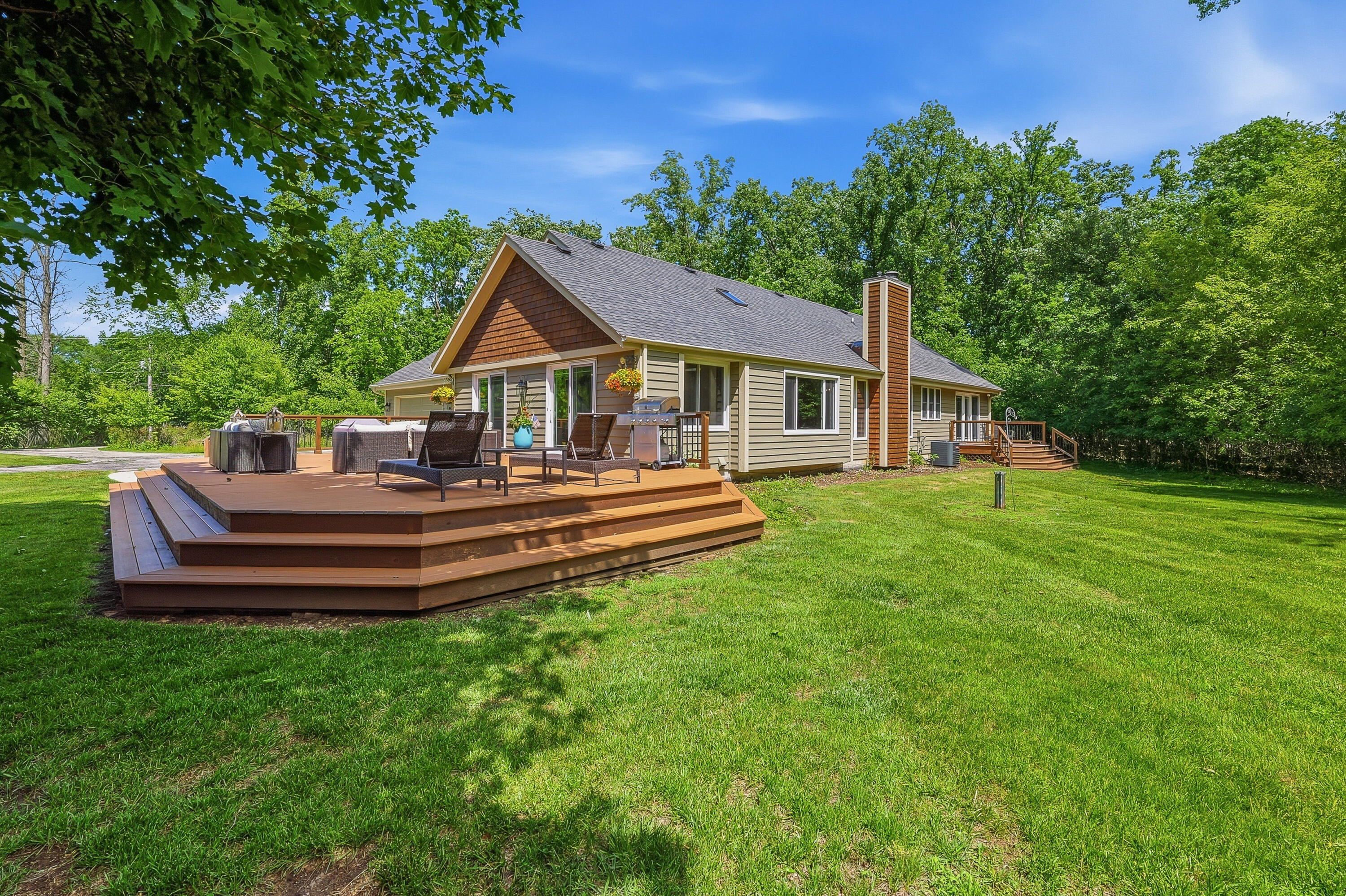 34899 Pabst Road Summit, WI 53066 - Photo 24 of 38 Composite deck with room to relax, entertain, and enjoy the space to roam.