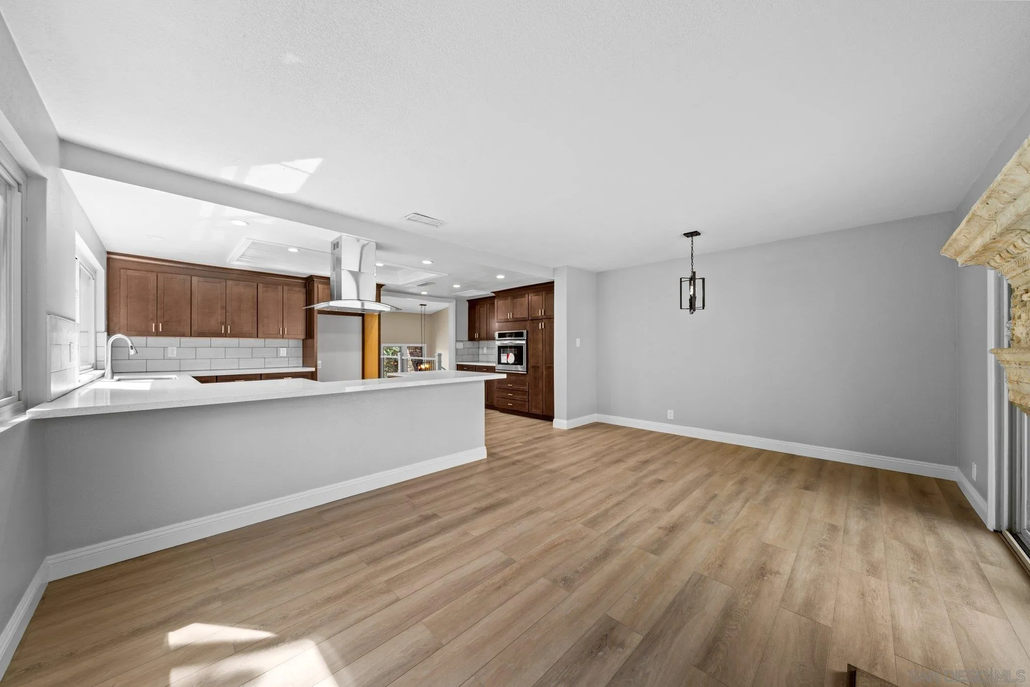 31241 Old River Road Bonsall, CA 92003 - Photo 11 of 51 a view of kitchen with wooden floor and electronic appliances