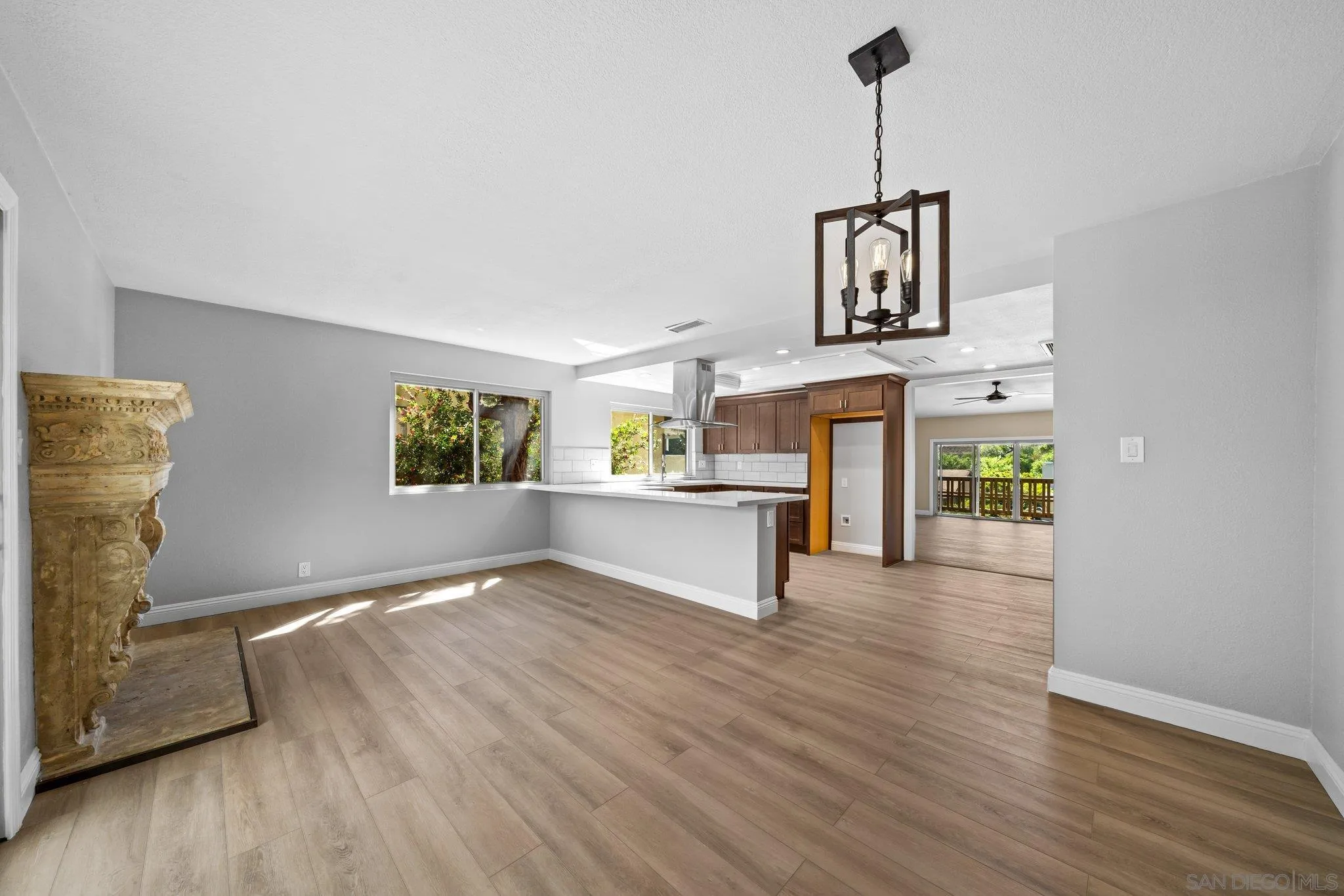 31241 Old River Road Bonsall, CA 92003 - Photo 12 of 51 a view of an empty room with window and wooden floor