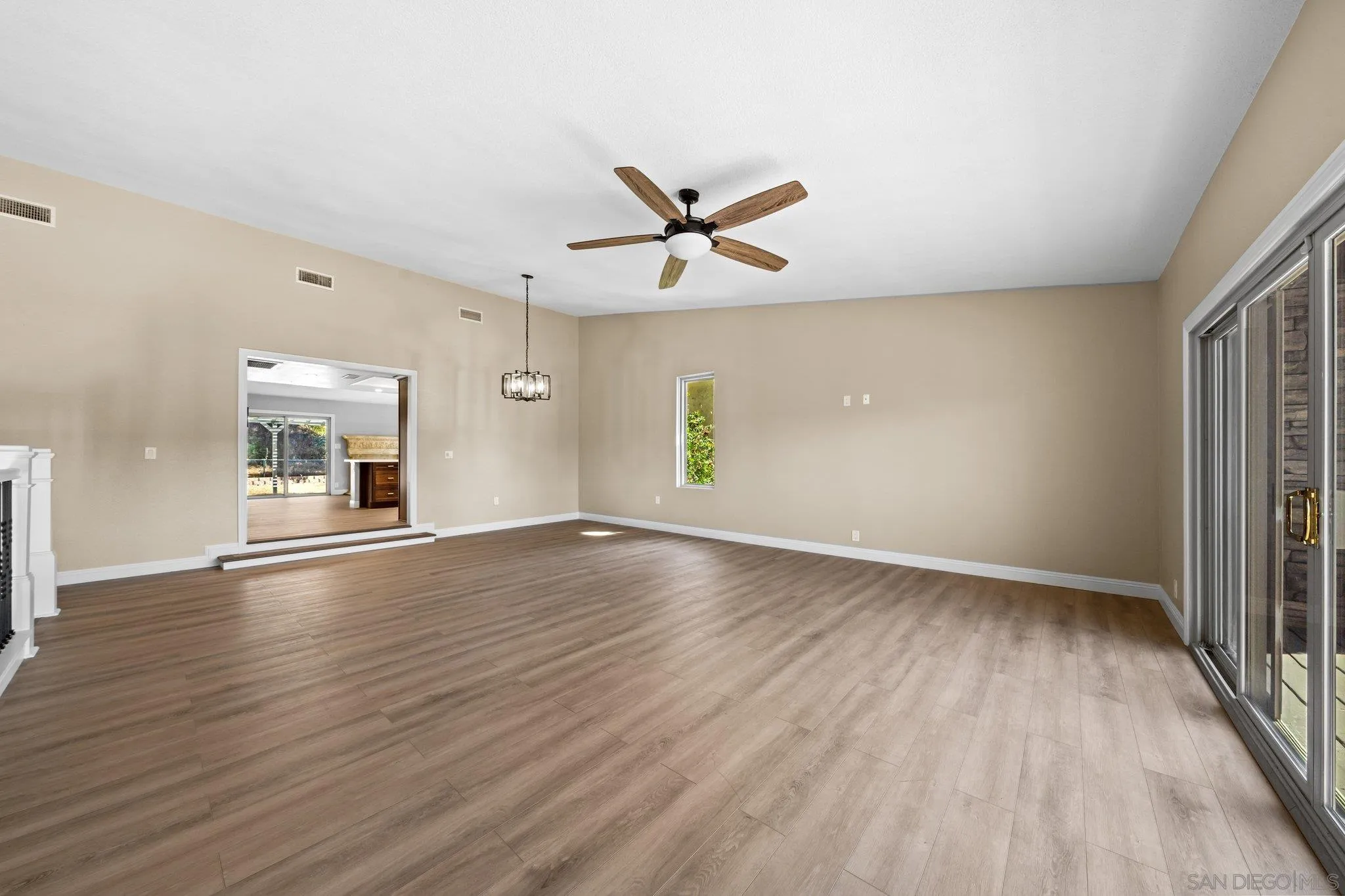 31241 Old River Road Bonsall, CA 92003 - Photo 13 of 51 wooden floor in an empty room with a window