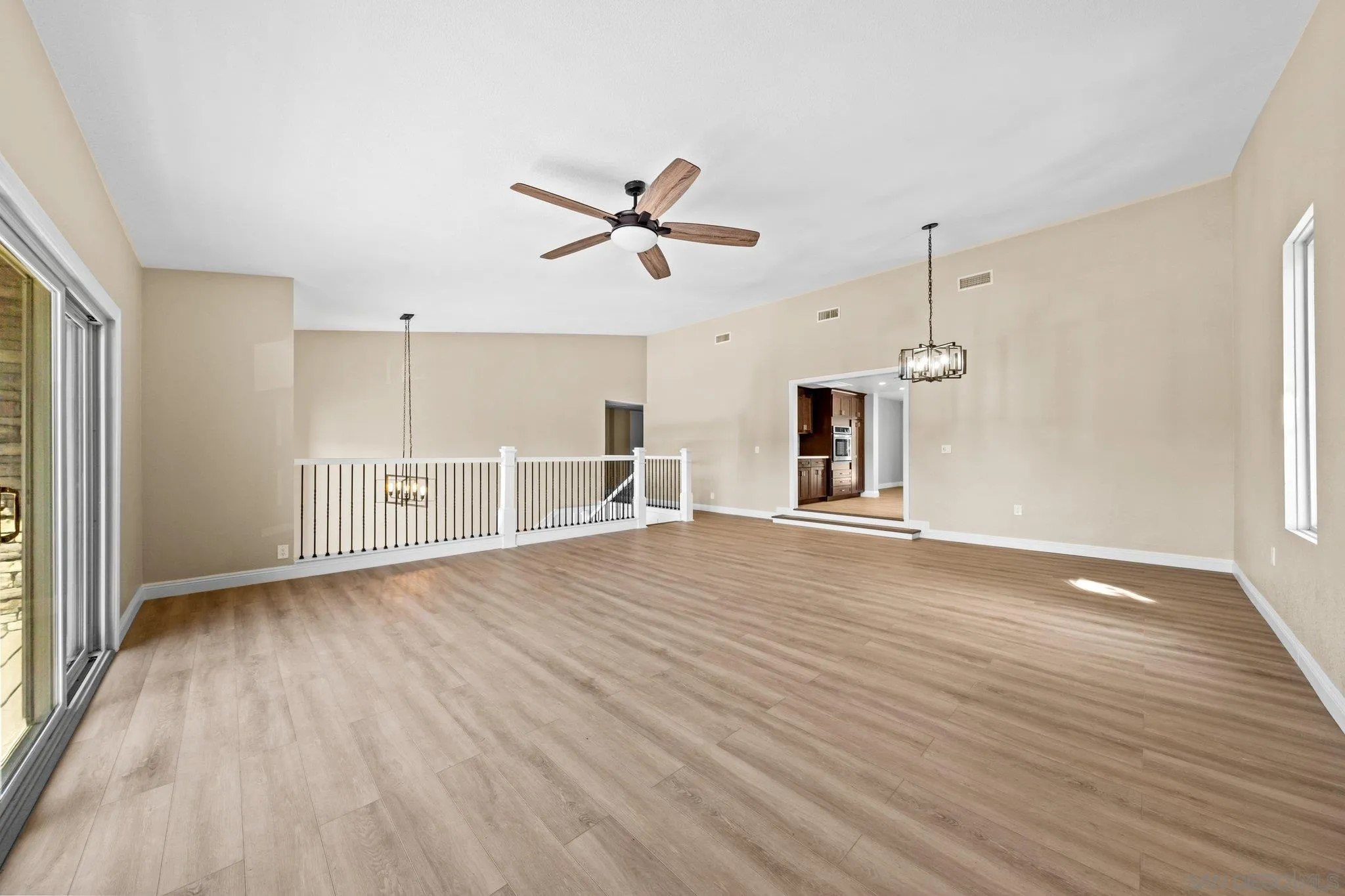 31241 Old River Road Bonsall, CA 92003 - Photo 14 of 51 wooden floor in an empty room with a window