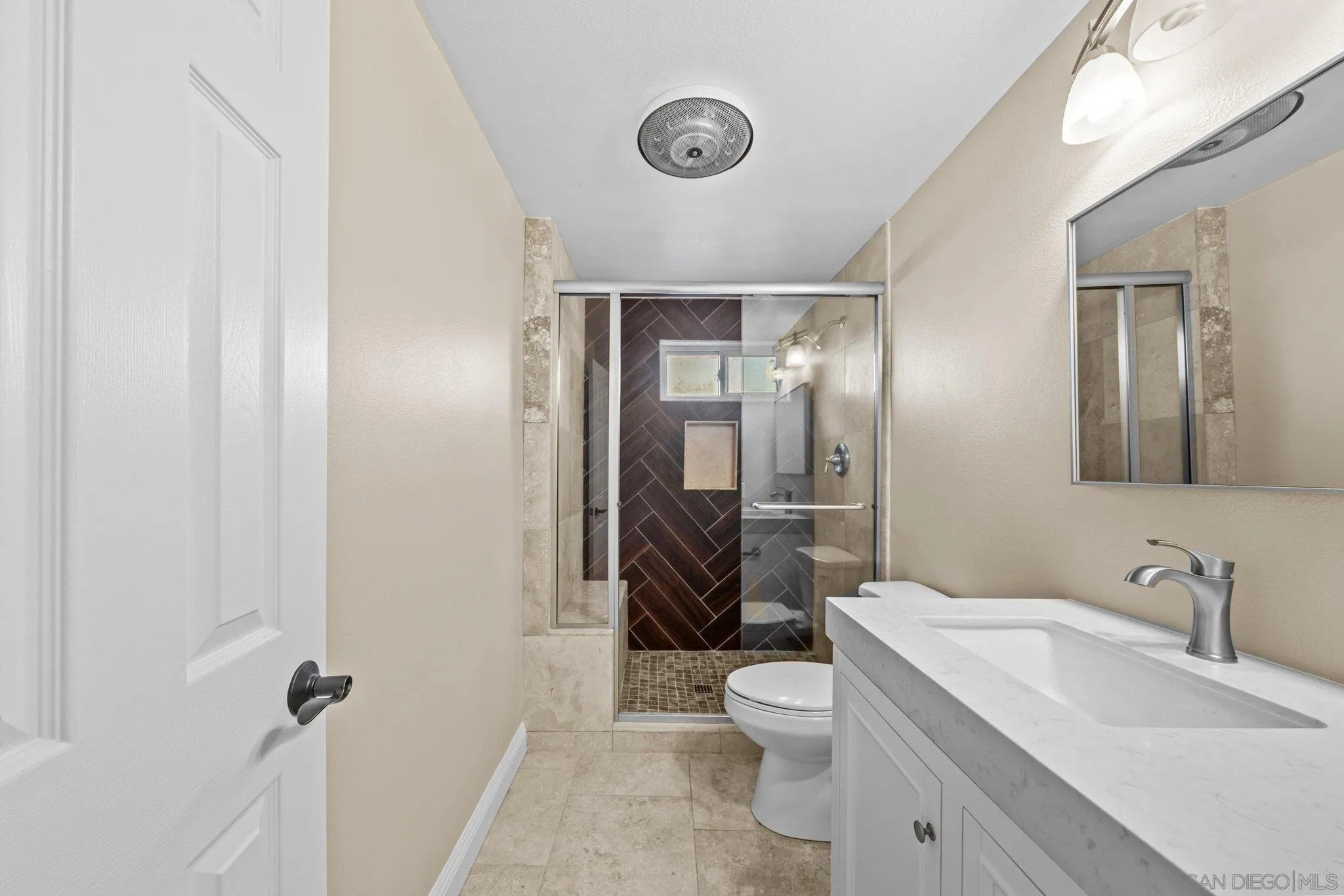 31241 Old River Road Bonsall, CA 92003 - Photo 18 of 51 a bathroom with a sink a toilet and shower