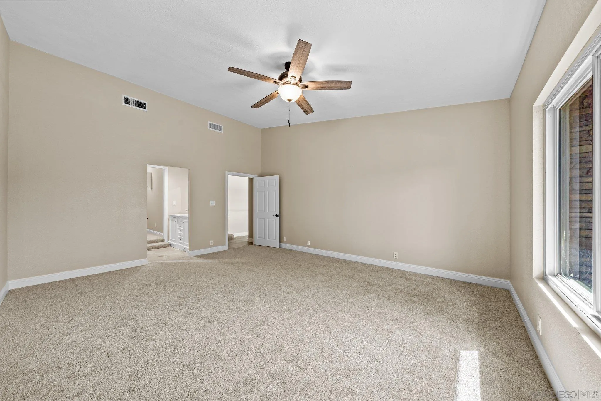 31241 Old River Road Bonsall, CA 92003 - Photo 21 of 51 a view of an empty room with a window