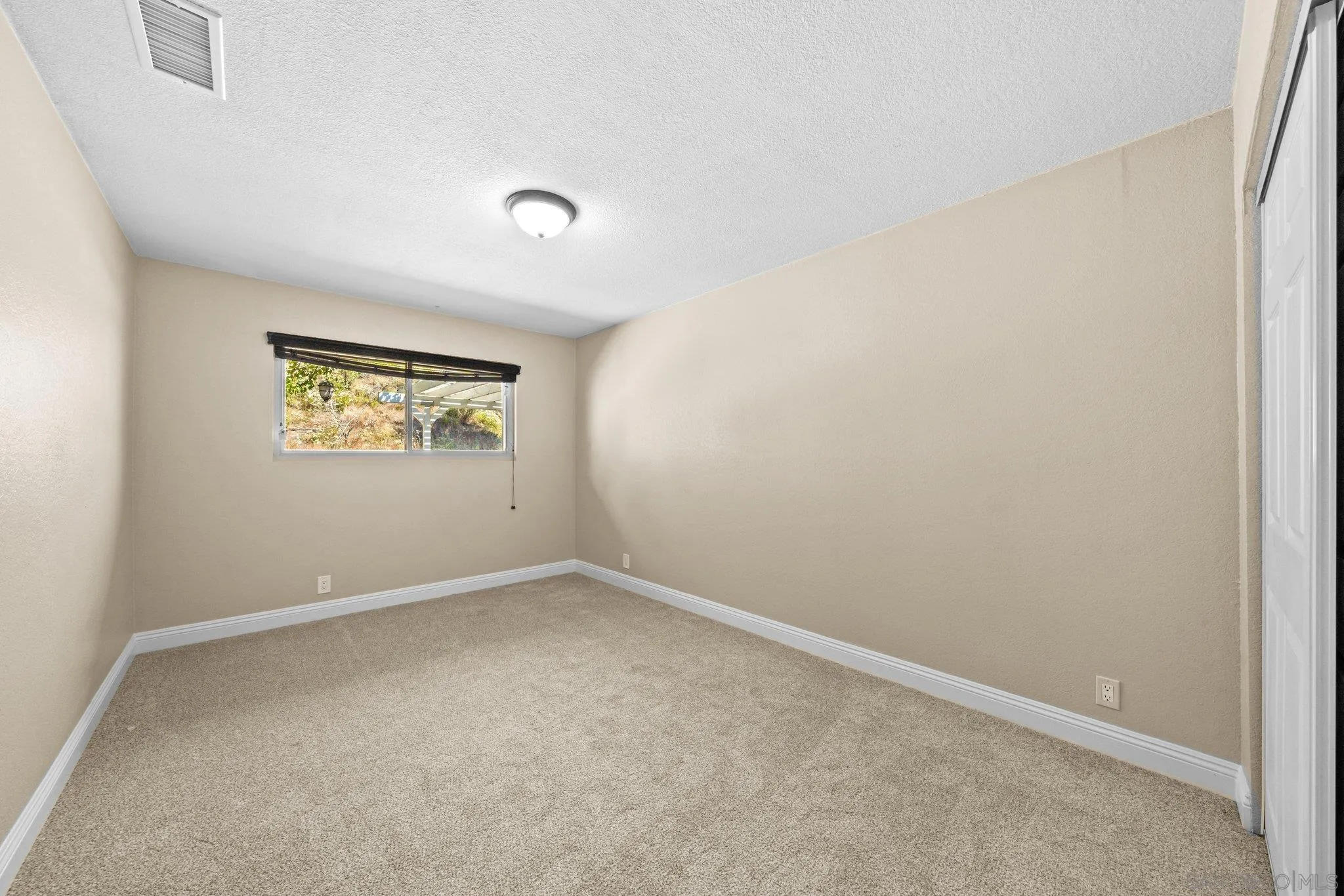 31241 Old River Road Bonsall, CA 92003 - Photo 29 of 51 an empty room with windows