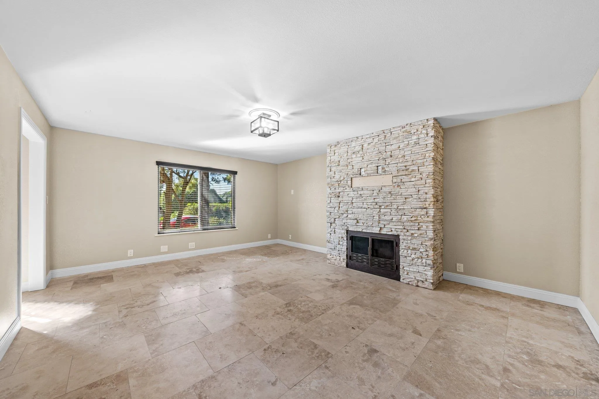 31241 Old River Road Bonsall, CA 92003 - Photo 38 of 51 an empty room with windows and fireplace
