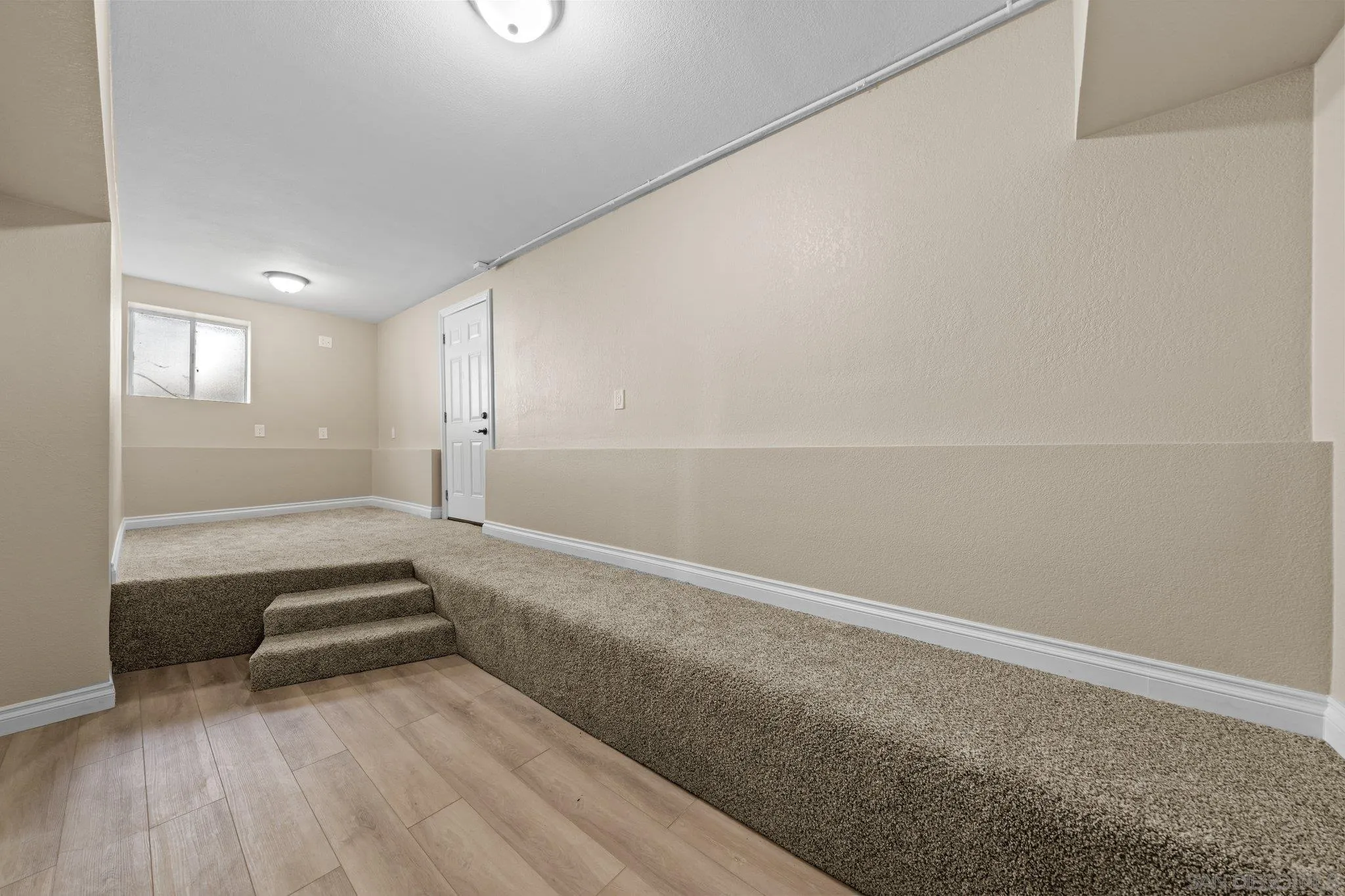 31241 Old River Road Bonsall, CA 92003 - Photo 43 of 51 a view of a room with wooden floor and windows