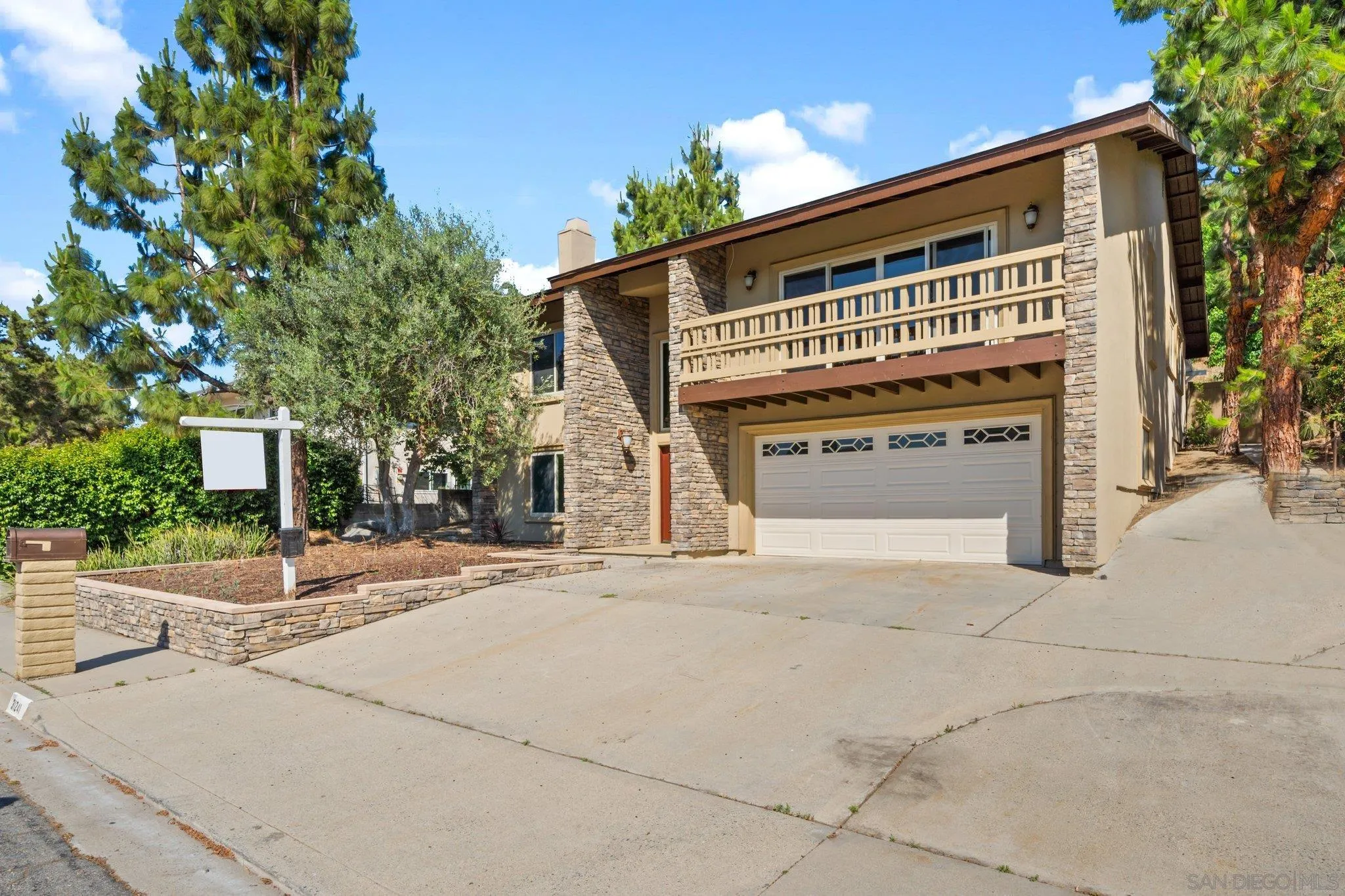 31241 Old River Road Bonsall, CA 92003 - Photo 50 of 51 a front view of a building with a yard and garage